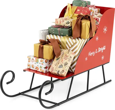 A red decorative sleigh filled with Christmas presents, set against a white background.
