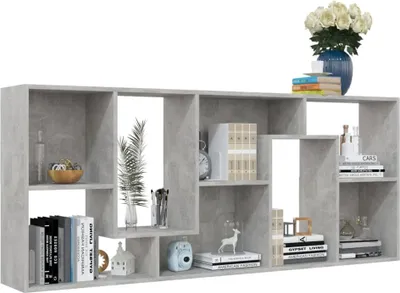 A gray bookshelf filled with books and decorative items.