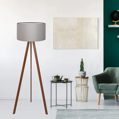 A modern living room with a floor lamp, armchair, and side table.