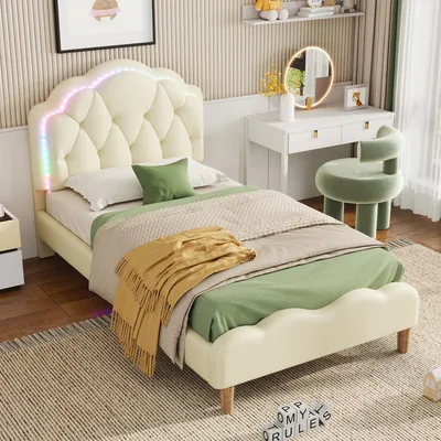 A child's bedroom with a bed, vanity, and chair.