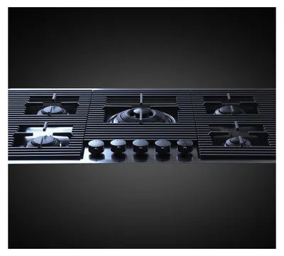 A close-up, studio shot of a gas stovetop.