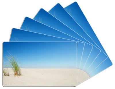 Produktbild von Wallario Frühstücksbrettchen 6er Set aus Glas, je 14 x 23 cm, mit rutschfesten Füßen, Motiv Sandstrand unter blauem Himmel