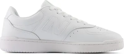 A white New Balance sneaker is shown from the side against a white background.
