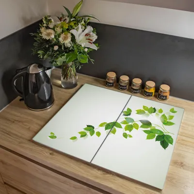 Zdjęcie produktu dla Dwuczęściowa osłona kuchenki Banjado, każda o wymiarach 30 x 52 cm, z gumowymi podkładkami dystansowymi, szkło bezpieczne ESG z motywem pnącza w kolorach żółtym i białym [HAP2 10355]