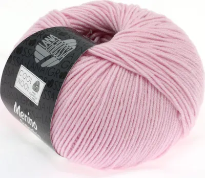 A ball of pink merino wool yarn with a label.