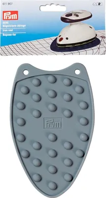 A product shot of a mini iron rest and its packaging.