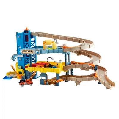 A toy car parking garage playset with ramps and accessories.