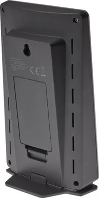 The back of a black weather station with a stand.