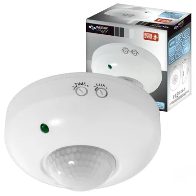 A white ceiling-mounted motion sensor with its packaging in the background.