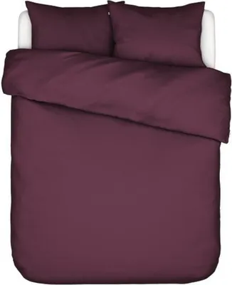A top-down view of a burgundy duvet cover and pillow set on a white surface.
