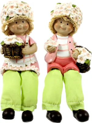 Two decorative figurines of children holding baskets of flowers.