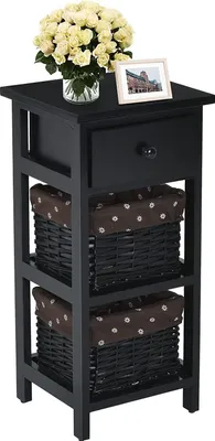 A black nightstand with a drawer and two woven baskets with brown fabric liners.