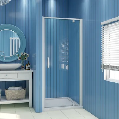 A bathroom interior with a shower cabin, vanity, and mirror.