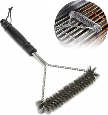 A grill brush with a black handle and stainless steel bristles is shown against a white background. A close-up inset shows the brush cleaning a grill grate.
