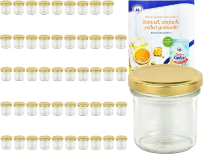 A set of glass jars with gold lids and a recipe booklet.