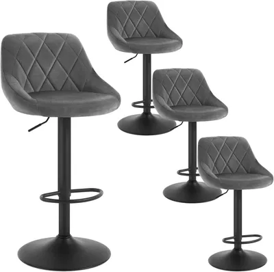 Four dark gray velvet bar stools with diamond tufting and black metal bases are arranged on a white background.
