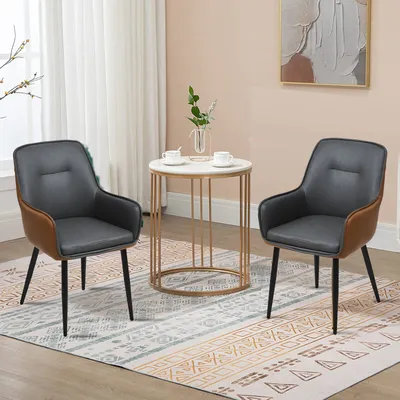 Two chairs and a small table in a room.