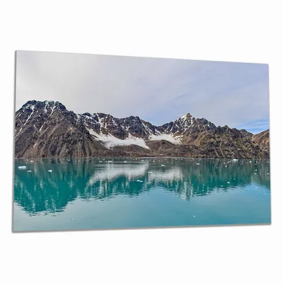 Produktbild von Wallario Herdabdeckplatte aus Glas, Größe 80 x 52 cm 1-teilig, Motiv Berge im arktischen Meer