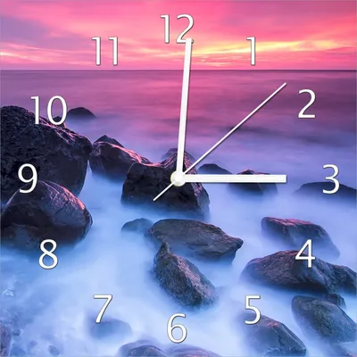 Produktbild von Wallario Design Wanduhr Felsen im Meer bei Sonnenuntergang aus Echtglas, Größe 30 x 30 cm
