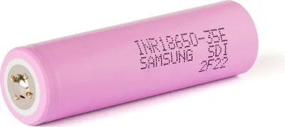 A single pink cylindrical battery with text printed on its side.