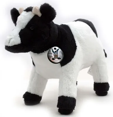 A plush toy cow with black and white patches, standing on a white background.
