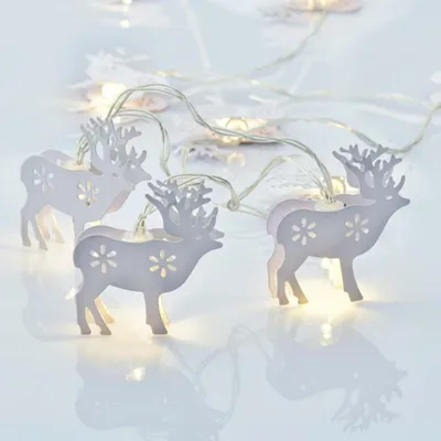 Immagine prodotto di ACA Lighting catena decorativa di renne in metallo, catena decorativa a 10 LED a batteria (2xAA) bianco caldo IP20 135+30cm cavo trasparente XB10WW2A