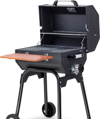 A charcoal grill with its lid open, showing the cooking grates and a wooden side shelf.