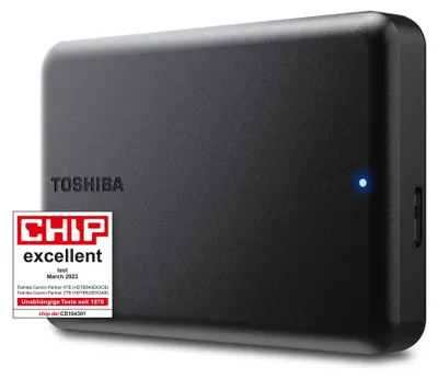 A black external hard drive is shown from a slight angle on a light gray surface.