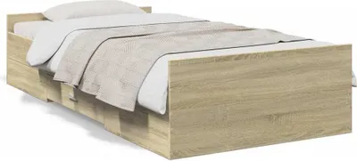 A close-up, angled view of a twin bed with storage drawers.