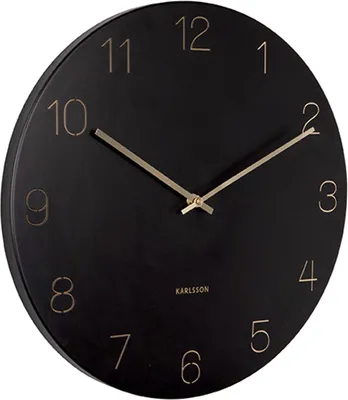 A black wall clock with gold numbers and hands.