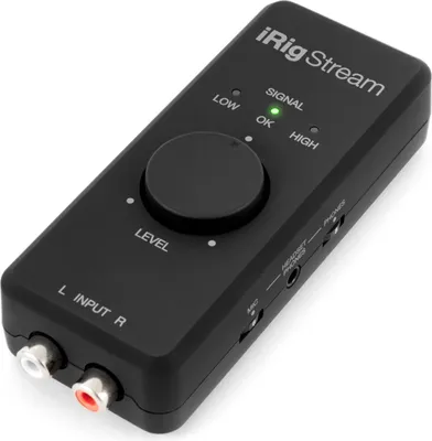 A black audio interface device is shown from a slightly elevated angle against a white background.