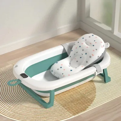 Immagine prodotto di Vaschetta da bagno per neonati - Vaschetta pieghevole - Con termometro per l'acqua - Morbido cuscino - Maniglia per la doccia - Dimensioni 76×45×18 cm - Età 0–6 anni - Verde