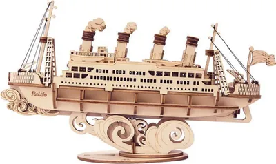 A wooden model of a cruise ship on a stand, designed to look like it's sailing through waves.