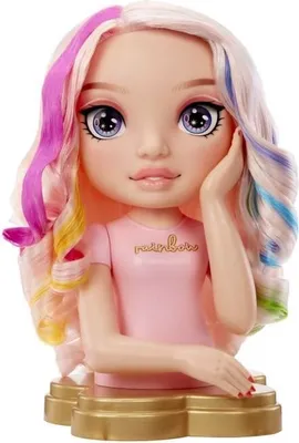 A close-up studio shot of a doll's head and shoulders, resting on a gold stand.