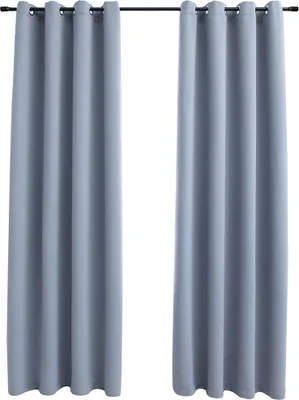 Two gray curtains hanging from a rod.