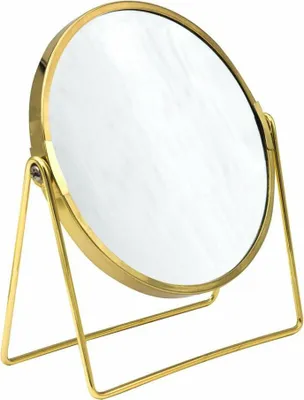 A gold-colored standing cosmetic mirror on a white background.