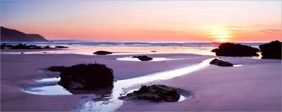 Produktbild von Wallario Poster - Sonnenuntergang am einsamen Strand, Kunstdruck Größe: 50 x 125 cm