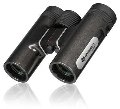 A pair of black BRESSER Spirit binoculars is shown against a white background.