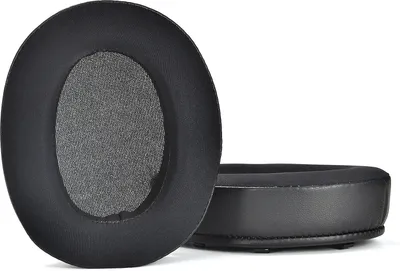 Two black ear pads for headphones are shown against a white background. One ear pad is shown from the front, and the other is shown from the side.
