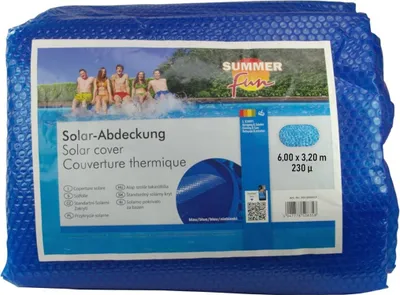 A folded blue solar pool cover is shown on a white background, with a label featuring a family jumping into a pool.