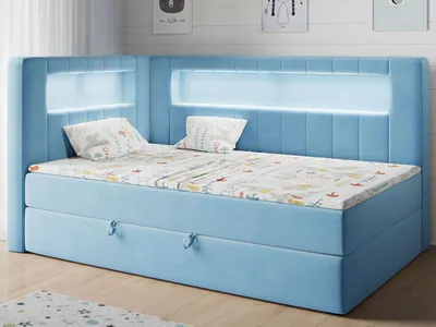A blue upholstered bed with integrated LED lighting and a patterned mattress.