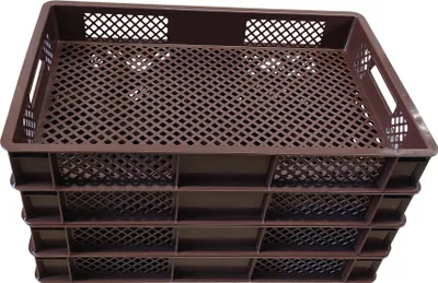 A stack of brown plastic crates with a grid pattern on the bottom and sides, and a perforated top.