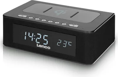 A black Lenco CR-580BK stereo FM-radiowecker with a digital display showing the time and temperature, and a wireless QI charging pad on top.