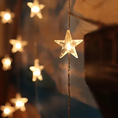 A close-up of star-shaped LED lights on a string.