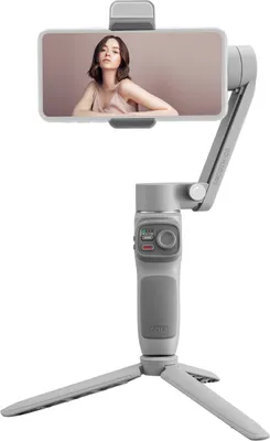 Obrázek produktu pro ZHIYUN SMOOTH-Q3: Ruční stabilizátor s 3 osami pro chytré telefony, přenosný gimbal pro natáčení videí. Maximální nosnost: 280 g. Vestavěné LED světlo s funkcí nabíjení, podpora ovládání gesty, ultraširokoúhlý zoom, režimy SmartFollow, panorama a portrét. Součástí je mini stativ