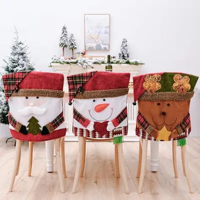 Produktbild von Set mit 3 Weihnachtsstuhlhussen mit Weihnachtsmann-, Schneemann- und Rentiermotiven, 55 x 45 cm, für den Innenbereich