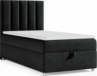 A black boxspring bed with a white topper and a tufted headboard, shown against a white background.