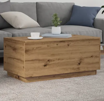 A coffee table in a living room setting with a couch in the background.