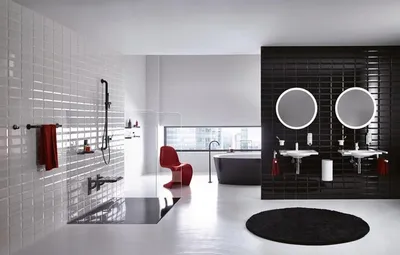 A modern, luxurious bathroom with a freestanding bathtub, a separate shower area, and a double vanity with illuminated mirrors.