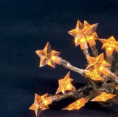 A close-up of a string of star-shaped LED lights.